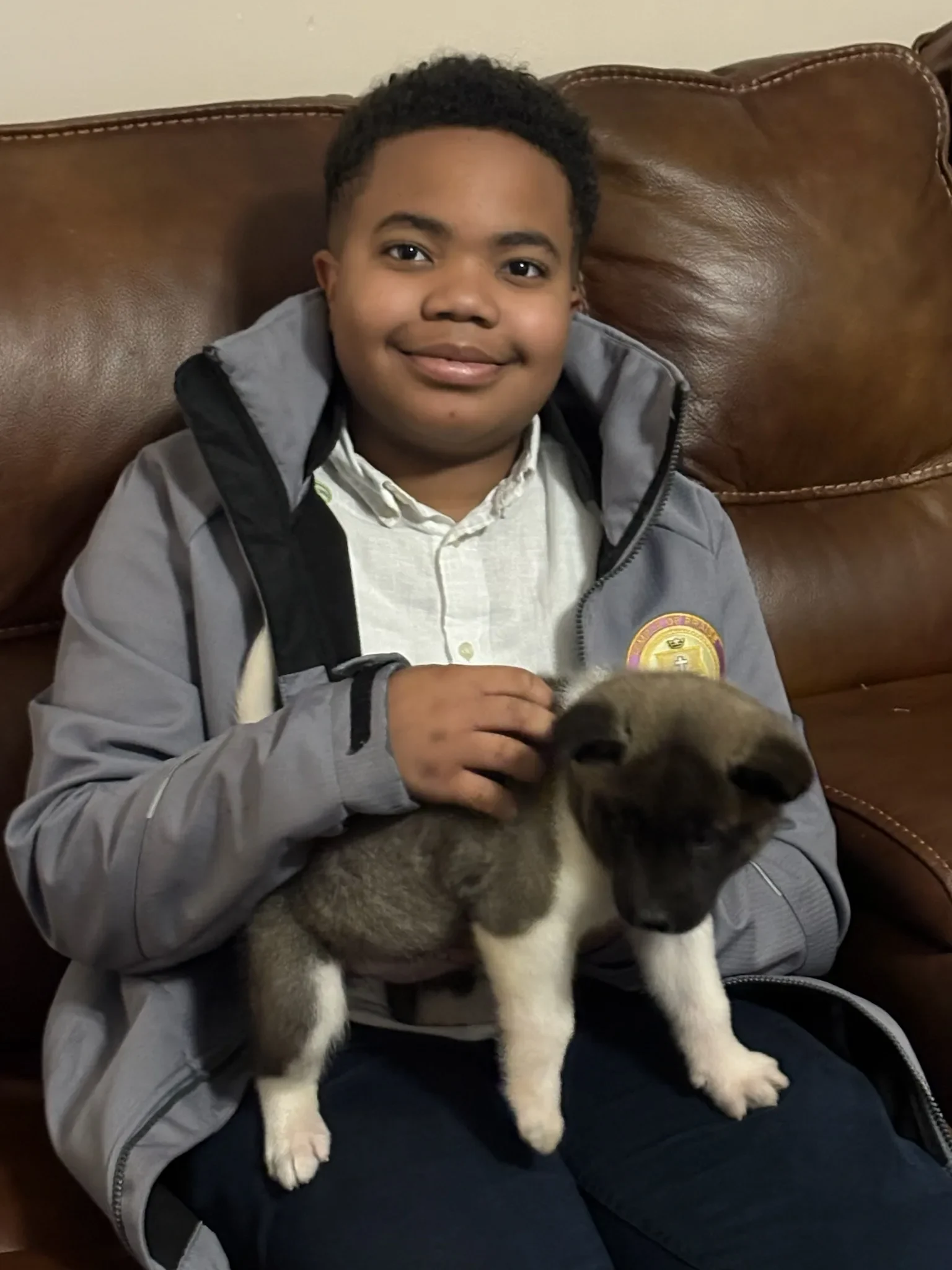The Briwder family with an Akita puppy
